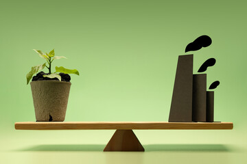 Environmental concept. Balance between Planting Trees and carbon-emitting factories, reflecting sustainability and pollution