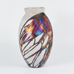 Decorative oval ceramic colorful rainbow tall vase on plain background
