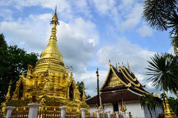 Fototapeta premium Pagoda and Chapel, Lanna Architecture, Symbols of Buddhism, South East Asia at wat Sri Mung Mueang, Doi saket, Chiang Mai, Northern Thailand
