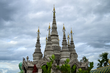 Fototapeta premium Pagoda in evening, Lanna Architecture, Symbols of Buddhism, South East Asia at Phra That Wisutthiyan Temple (Trailaksanaram Forest Temple) Doi saket, Chiang Mai, Northern Thailand