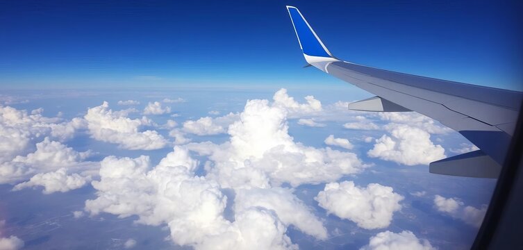 Airplane window view, clouds, wing, landscape below,  plane,  white