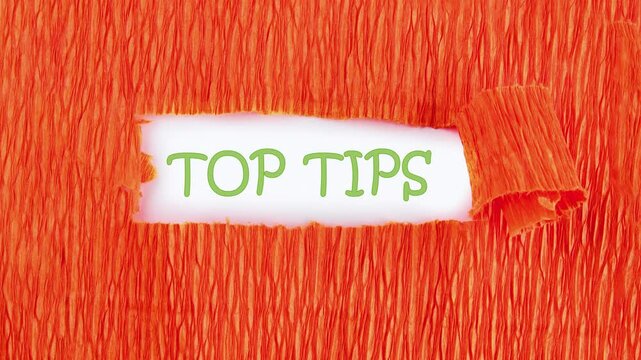 The phrase TOP TIPS appears under the paper on a white background. Animation of the TIPS text.