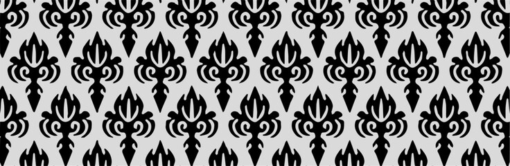 Bold black and white stylized leaf pattern with vertical repetition for use in traditional or ethnic designs.