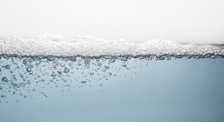 Bubbles rising in clear water against a soft white background, creating a serene aquatic atmosphere