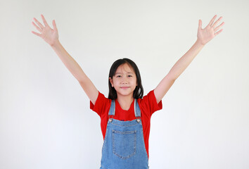 Smiling Asian girl child raised palm hands up on white studio background. Question and answer concept.