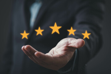 A hand displaying five golden stars, symbolizing excellence or high ratings in a professional context.