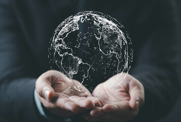 A person's hands hold a digital globe, symbolizing global connectivity and technology in a modern, professional setting.