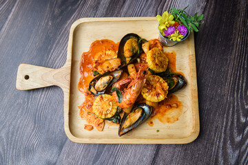 Top View of Spicy Stir-Fried Seafood with Garnish.