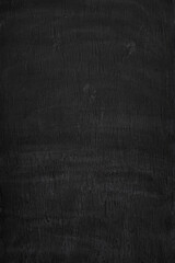 Front view of dirty, stained and dark, almost black, wall. Abstract full frame textured grunge background in black and white, copy space.