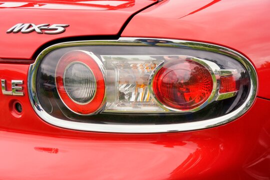 Stockholm, Sweden - June, 6th 2025: Well-known badge on an iconic model - Mazda MX-5 (also known as Miata).