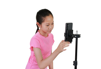 Asian young girl recording video blog on smartphone isolated on white studio background.