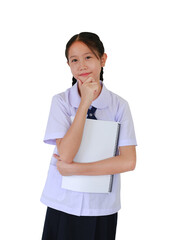 Portrait of Asian student girl in school uniform with hand on chin gesture imagines something in her mind while holding a book against white background.