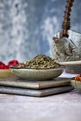 Dried Green Tea Leaves on Bright Background. Close up.	