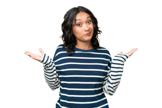 Young Argentinian woman over isolated background having doubts while raising hands