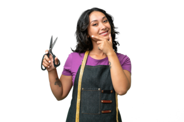 Young seamstress argentinian woman over isolated background happy and smiling