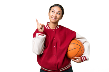 Young Uruguayan woman playing basketball over isolated wall  over isolated chroma key background pointing up a great idea