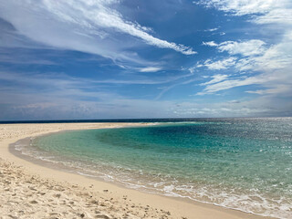 Transparent ocean water with sunlight reflection. Sandbanks in Camiguin Island. Philippines.