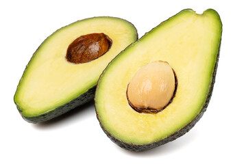 Healthy food and ingredients - Half of ripe organic green avocado fruit with pit isolated on white background with built-in clipping path
