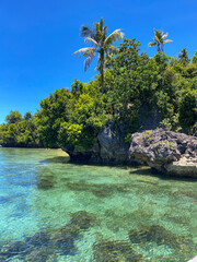 Turquoise ocean water in tropical island. Blue sea and clouds. Philippines.