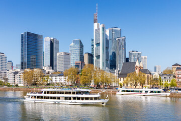 Frankfurt skyline skyscrapers with banks on River Main with excursion boats in Frankfurt, Germany