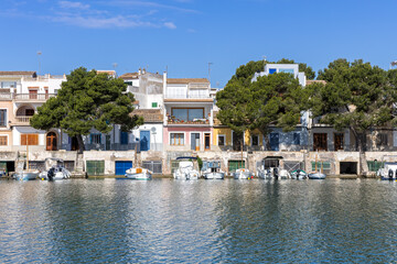 Portocolom fishing village on Mallorca island with boats and colorful houses holiday by the sea in Spain