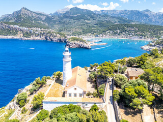 Port de Soller on Mallorca island with lighthouse from above aerial view holiday by the sea in Spain