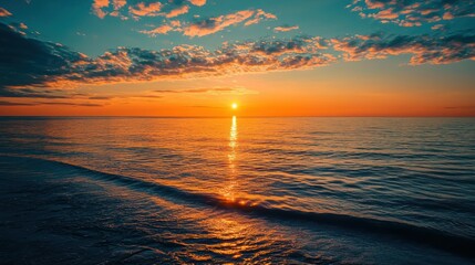 Obraz premium A peaceful sunrise over the ocean