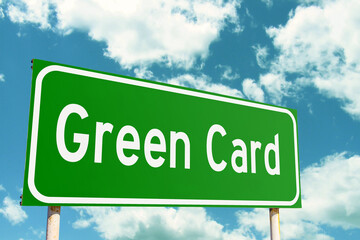 US Green Card Road Sign with clouds sky background