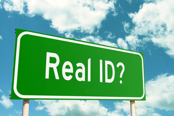 Real ID Green Road Sign with clouds sky background