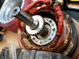 Close-up of an electric motor in a car repair shop.