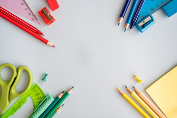 Back to school.  Flat lay. Gray background with stationery.  Space for text