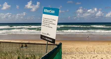 A public notice on the beach at Surfers Paradise, following Tropical Cyclone Alfred.