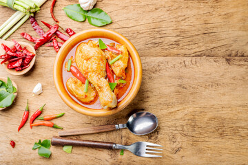Chicken curry Asian food masala. Traditional cooking healthy food with spices. Arranged on wooden table background.