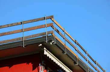 barrier is a practical solution for protecting workers from falling during repair work on the roof of the condominium after a hailstorm that broke many tiles