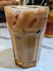 Rich and Creamy! Teh Tarik, Malaysia's beloved national drink, featuring infused black tea with milk, served in a velvety thick froth.