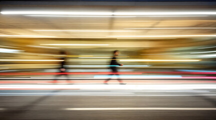 Motion blur of a person walking in a dynamic urban environment with light trails