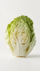 Fototapeta premium A close up of a halved head of lettuce with visible layers on a plain white background studio shot