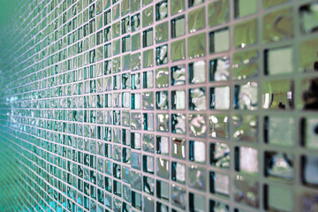 Background Series : Mosaic tile wall with mirror surface.