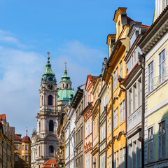 The dome and bell tower of the ancient Church of St. Nicholas on Lesser Town Square in Prague on a spring day