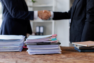 Happy business asian manager handshaking client at meeting. Smiling female hr hiring recruit at job interview, insurance agent, lawyer making contract deal at work with business handshake.