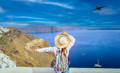 Happy moment freedom young tourist woman lifestyle Relaxation as fresh of summer with back view of young woman in hat  at  Santorini island ,Greece