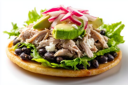 Delicious panuchos with fried tortillas featuring black beans, shredded turkey, lettuce, pickled onions, and avocado, traditional Yucatecan dish on a clean white background