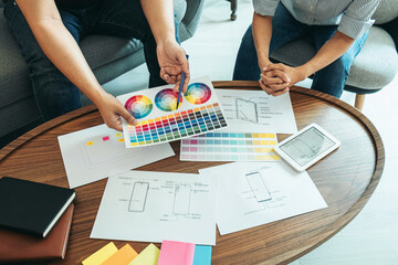 Fototapeta premium Team of Creative Web/Graphic Designer planning, drawing website ux app for mobile phone application and development template layout, process to developing prototype wireframe, User experience concept