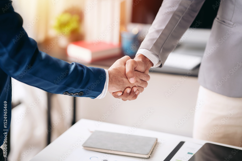Poster two men shake hands in a business setting