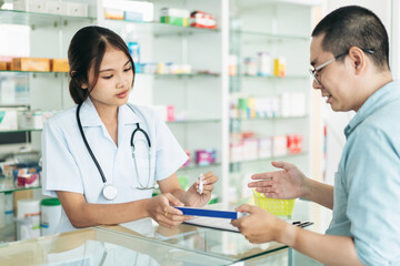 A woman and a man are talking in a pharmacy
