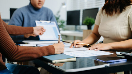 Fototapeta premium Business documents on office table with smart phone and calculator digital tablet and graph business with social network diagram