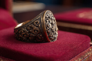 Antique ring displays intricate carvings, radiating timeless elegance