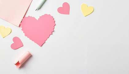 Colorful paper hearts and stationery on white background  
