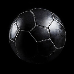 Sleek Black Handball Isolated on Dark Background for Sports Concept