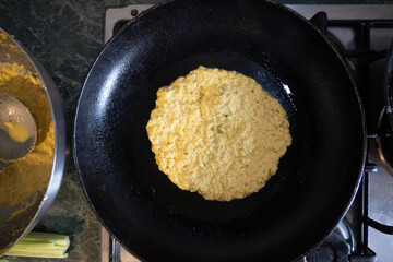 Artisanal preparation of corn cachapas, a typical Venezuelan dish.